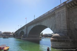 Stone bridge with arch supports over a lake