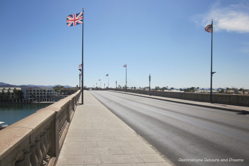 Flags waving on the sides of a bridge