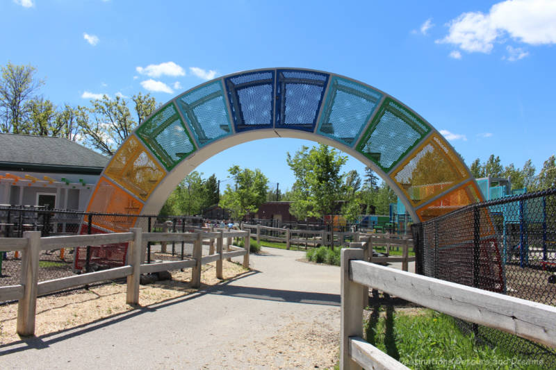 Covered colourful bridge for goat crossing at a zoo