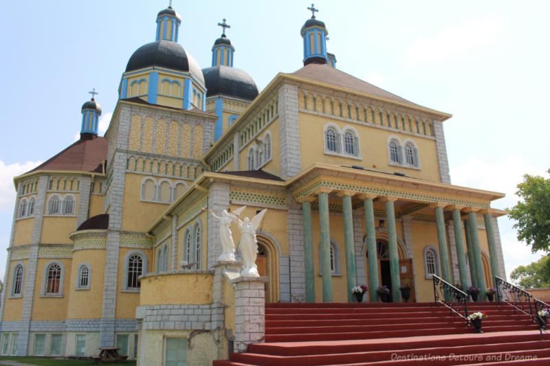 Onion domed southern Manitoba Ukrainian Catholic church in yellow and blue colours of Ukraine flag