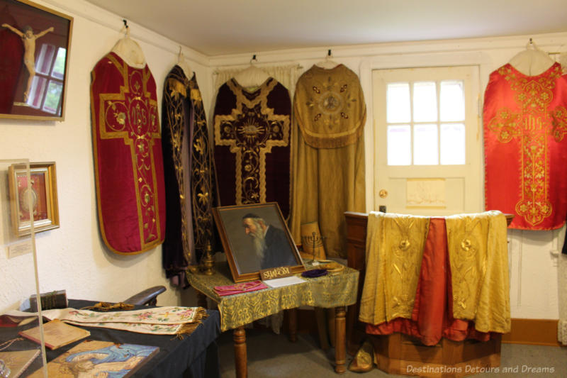 A collection of priest robes on display