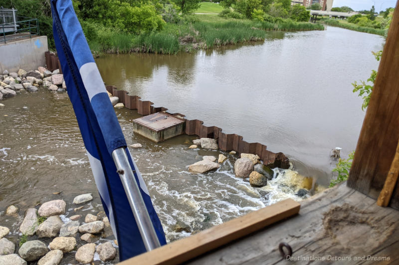 Small low level dam in a creek to support a water mill replica