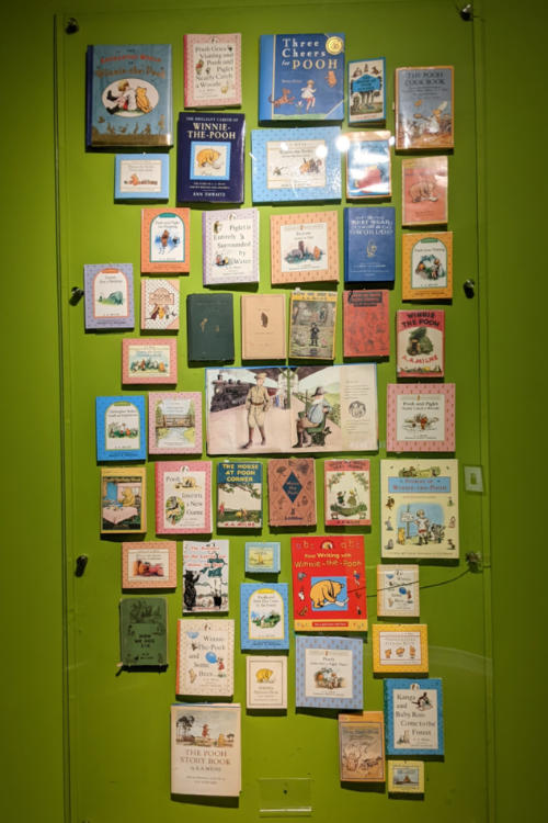 Display of Winnie-the-Pooh books hanging on the wall
