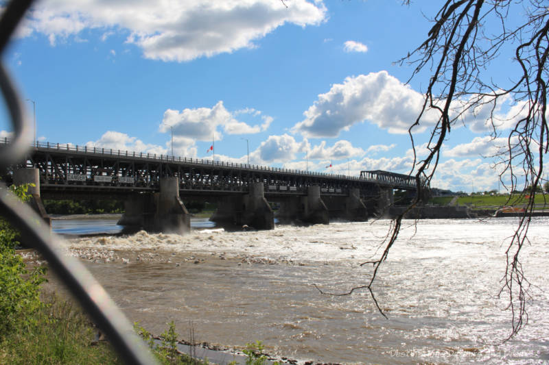 Bridge, dam and lock crossing the Red River at Lockport