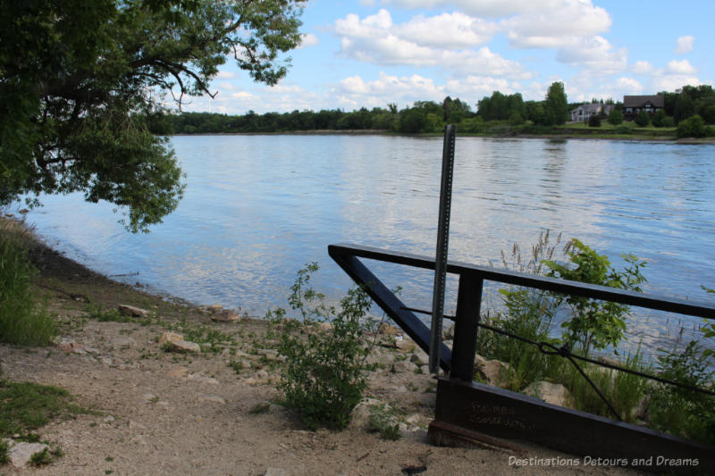 Access to river's edge with view across river to houses on other side