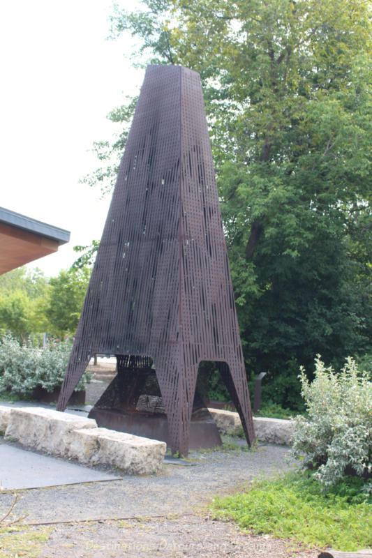 fireplace sculpture of plasmacut steel in a park