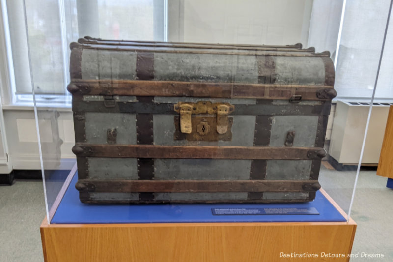 An old travel trunk from the late 1800s in a museum