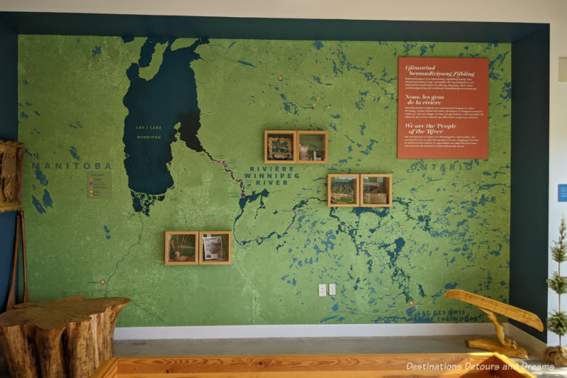 A large green map painted on a wall to show the Winnipeg River System