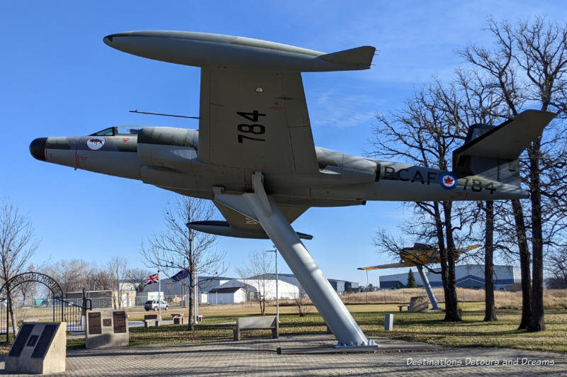 CF-100 Canuck aircraft mounted on pillar on display in outdoor park