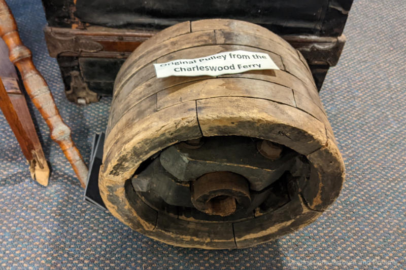 Wooden ferry pulley on display in a museum