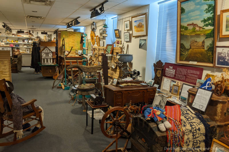 Museum room crammed with artifacts along the outer walls